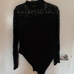 New black lace body suit size 16/2XL fitted.